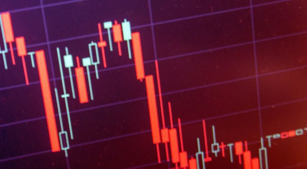 Chute brutale d’un actif financier sur un graphique boursier, illustrant une manipulation de cours sur les marchés